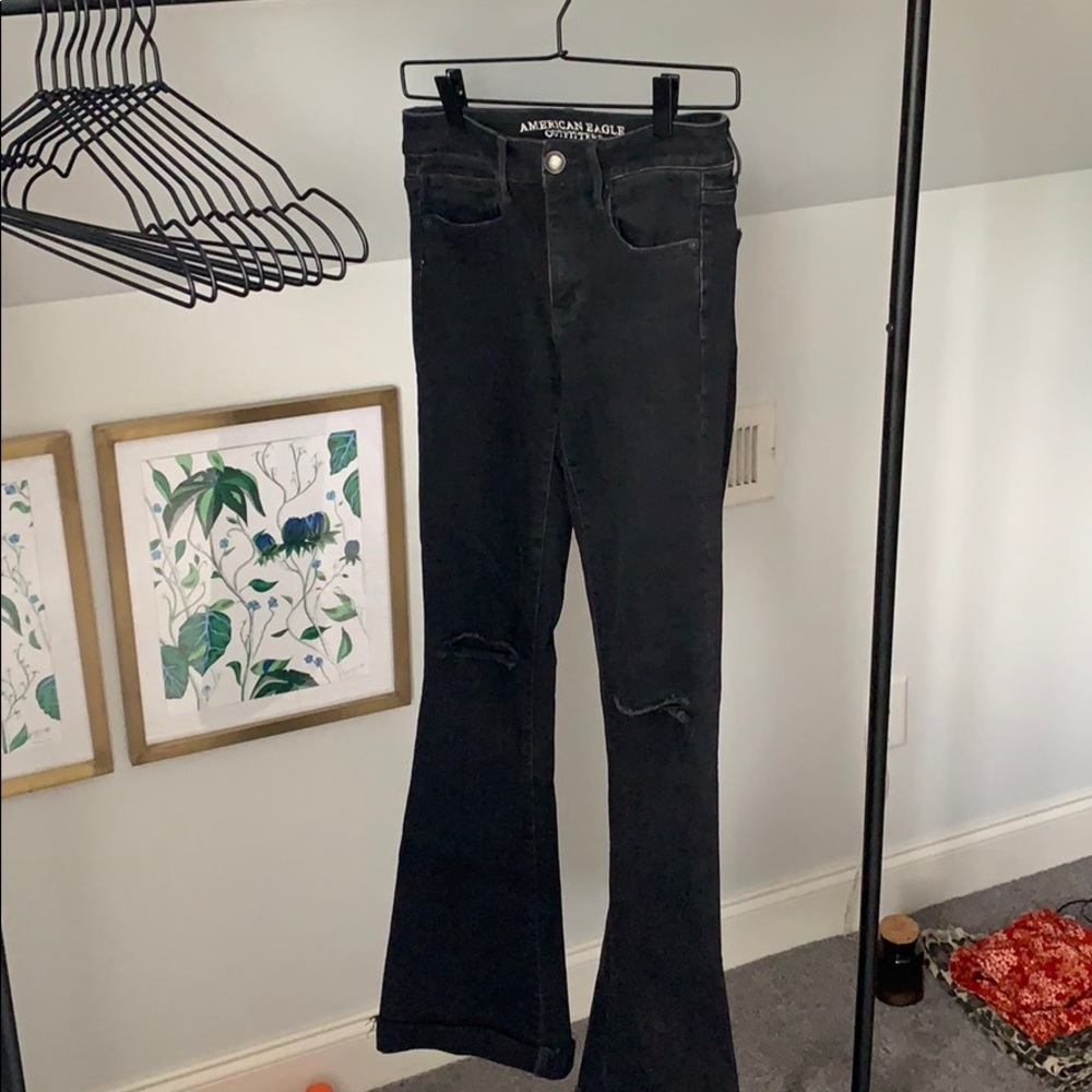 Black flare ripped knee jeans
